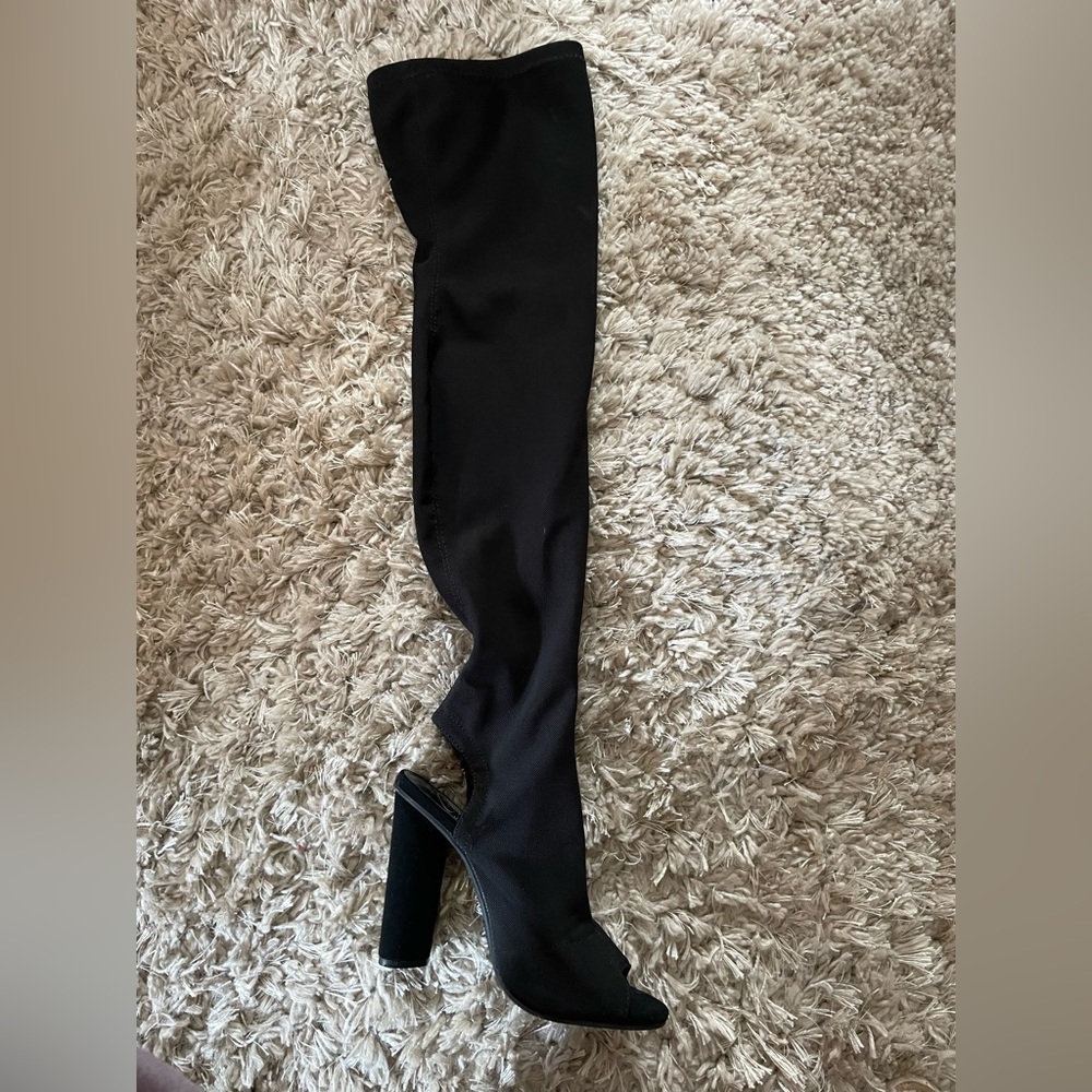 Thigh high black heels. Thin mesh material